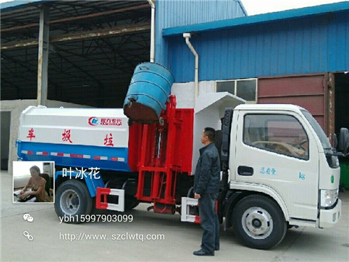 東風(fēng)小多利卡側(cè)裝掛桶式垃圾車正在提升鐵制垃圾桶圖片演示